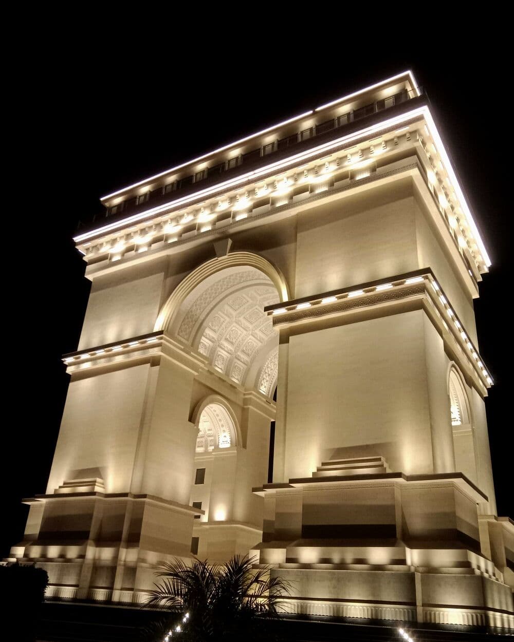 The Faisal Hills arch monument, lit at night